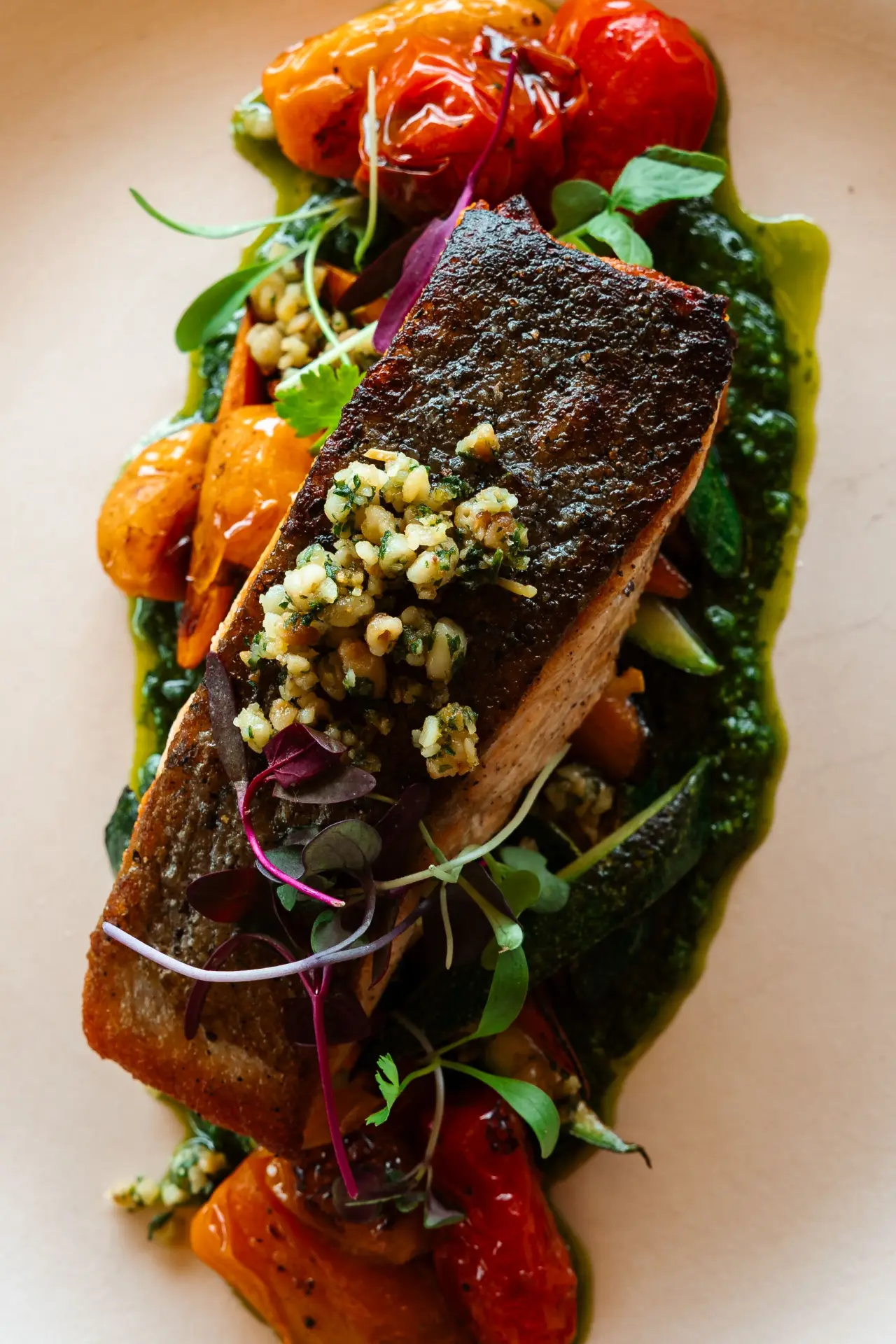 Crispy-skin salmon over greens
