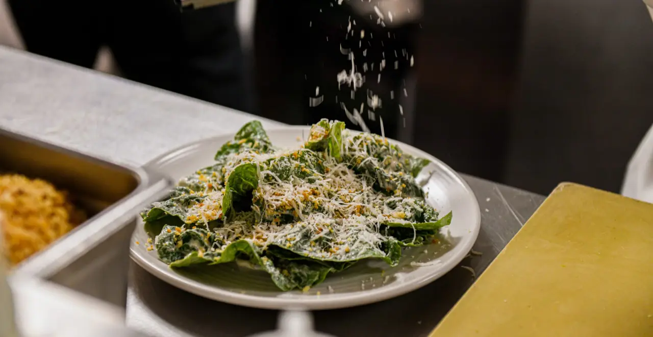Caesar salad under a shower of parmesan