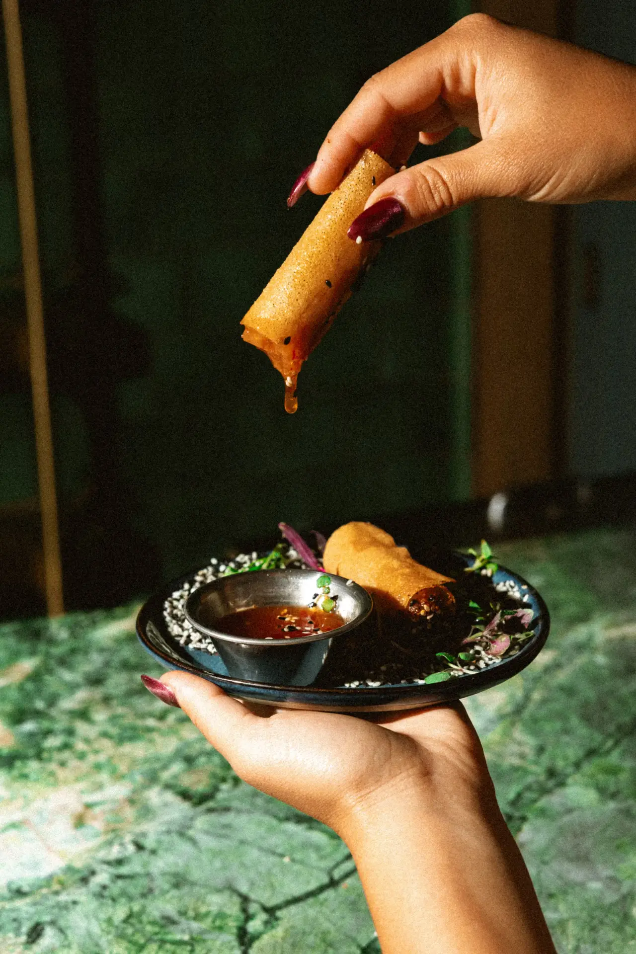 A bite dipped in sauce