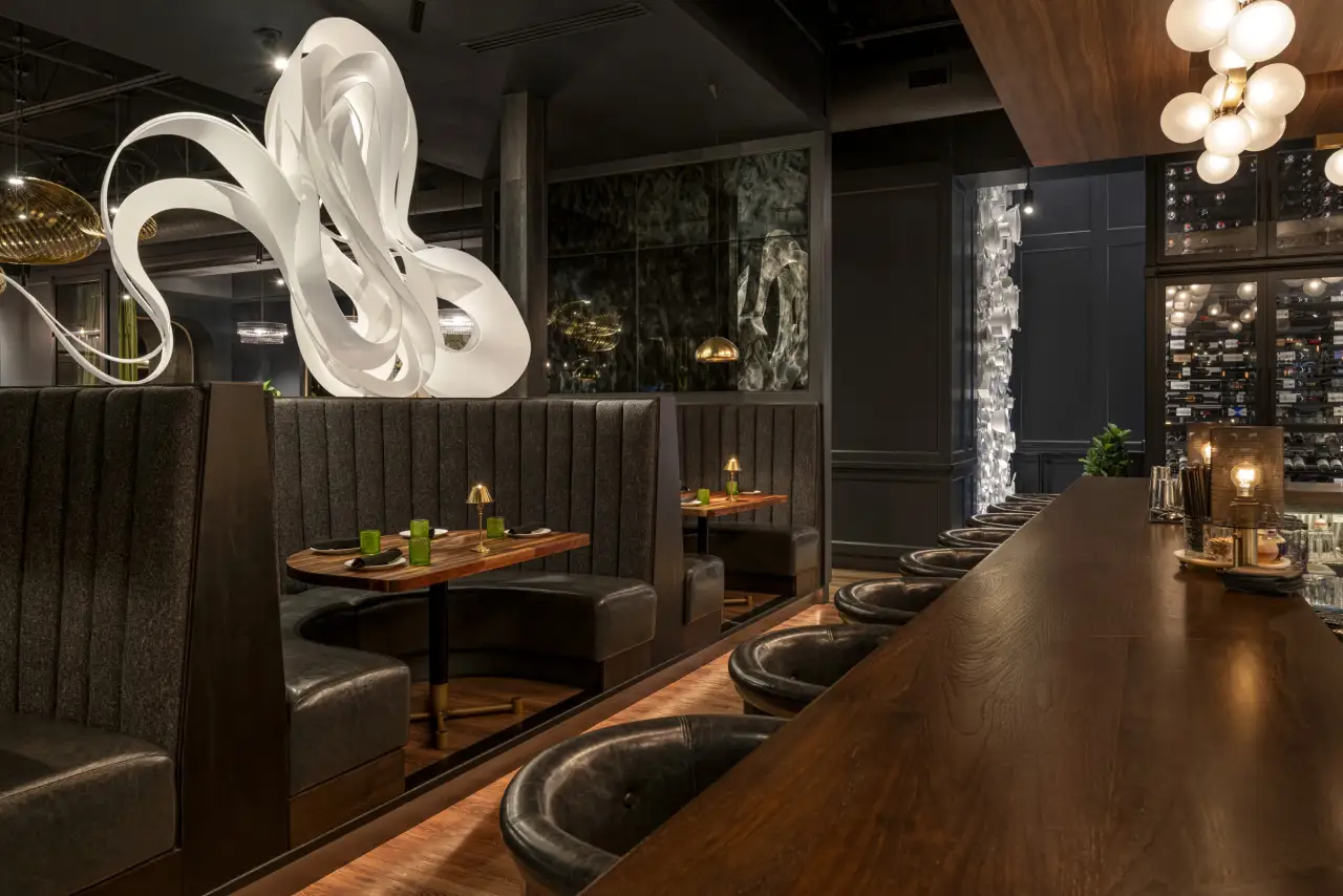 The bar and booths at The Americano
