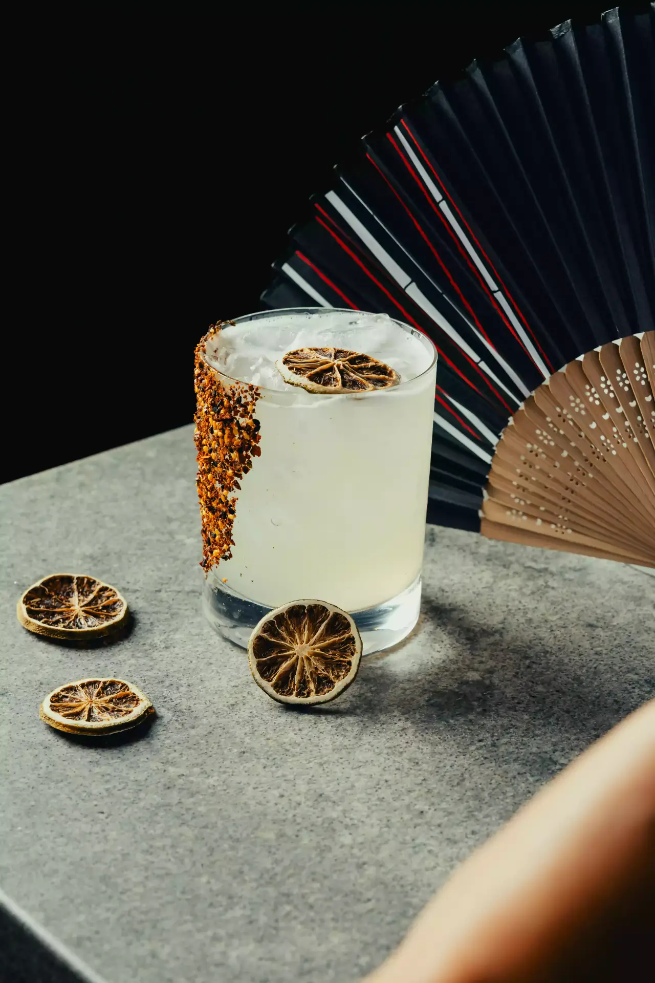 A spicy citrus cocktail with dried lime