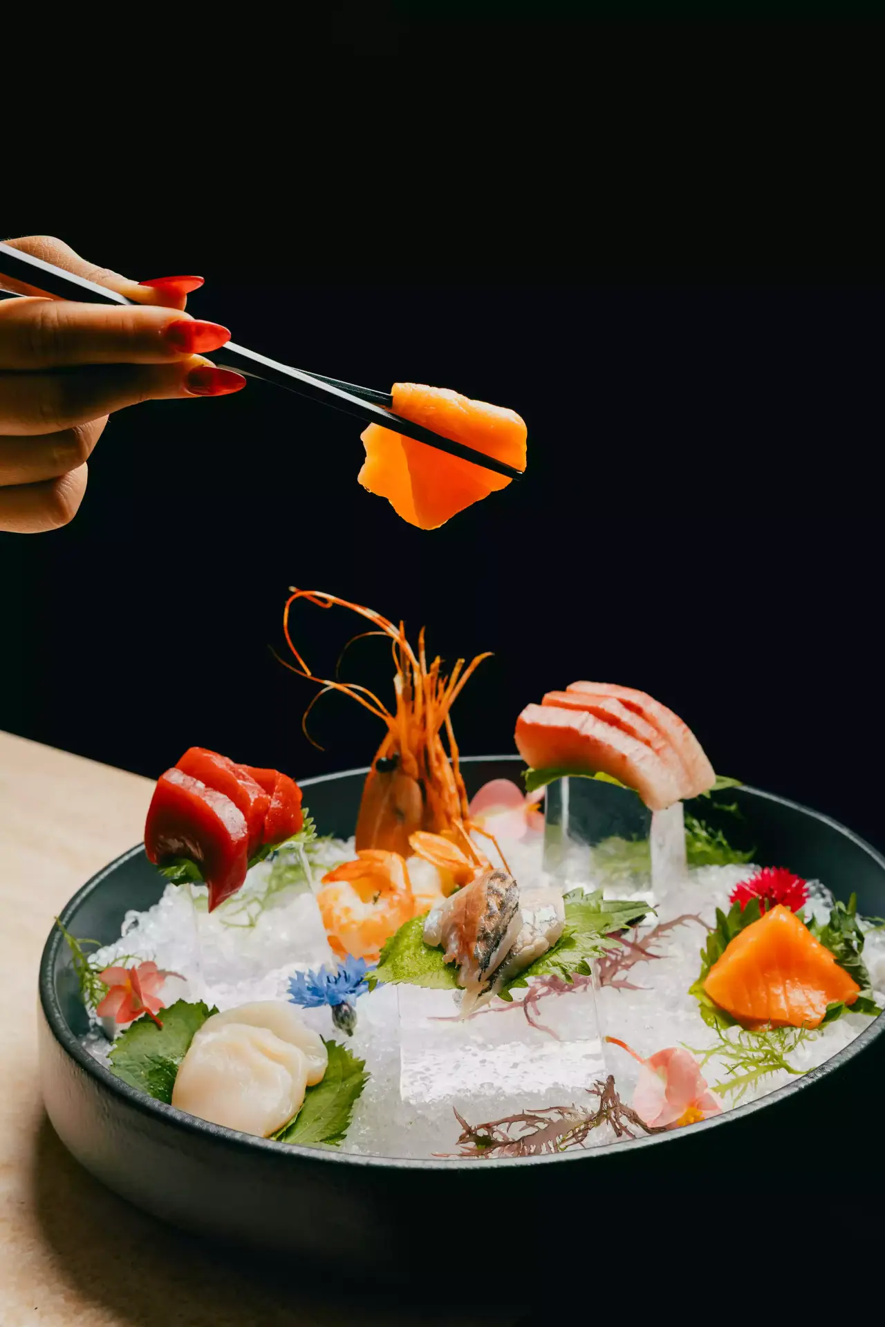 A sashimi platter on ice at the KUZA raw bar